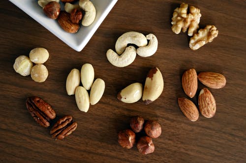 Various nuts scattered on the table.